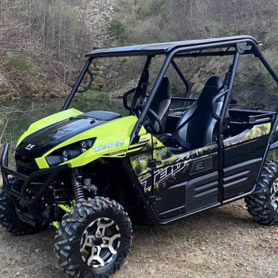 a motorcycle parked on the side of a dirt field