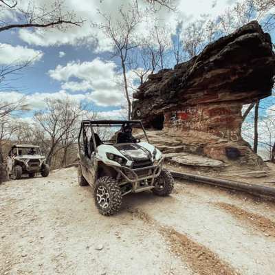 a car parked on a dirt road