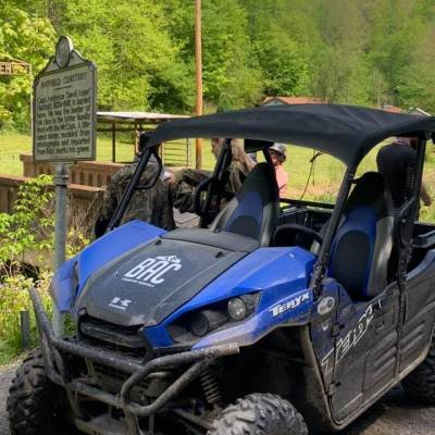a blue car parked in a parking lot