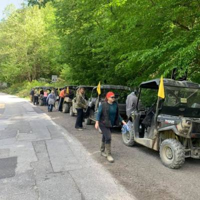 a group of people riding on the back of a truck