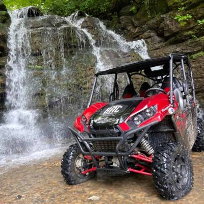 a motorcycle parked on a dirt road