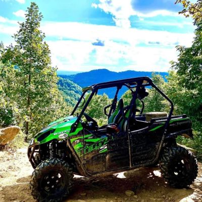 a truck driving down a dirt road