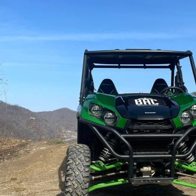 a truck driving down a dirt road