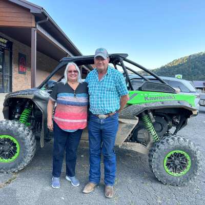 a person standing in front of a truck